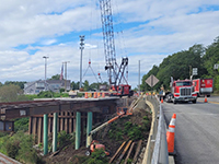 Roadside view of placed steel beams.